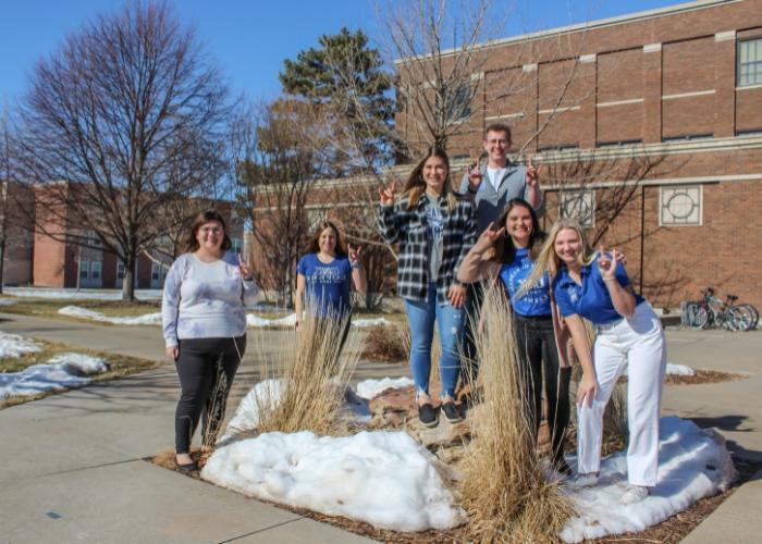 Six students posing for photo on campus